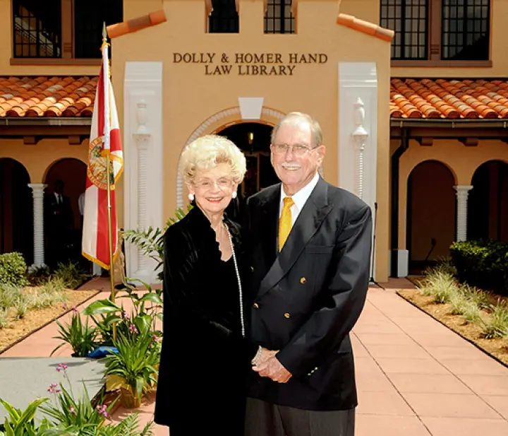 Dolly and Home in front of the Dolly & Homer Hand Law Library